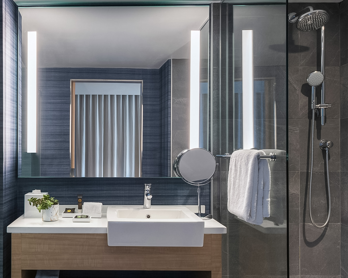 a bathroom with a shower and sink