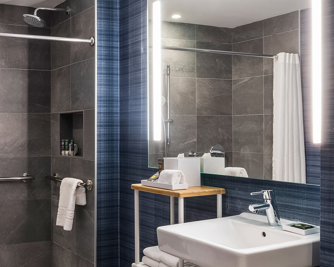 a bathroom with a mirror and sink