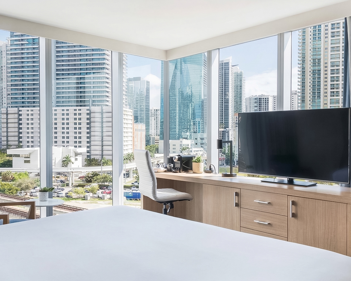 a room with a large window and a television