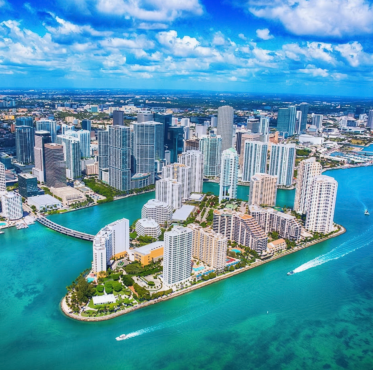 a city with tall buildings and a body of water
