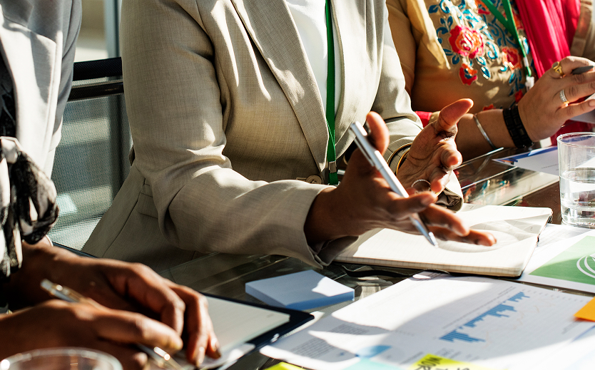 a group of people sitting at a table