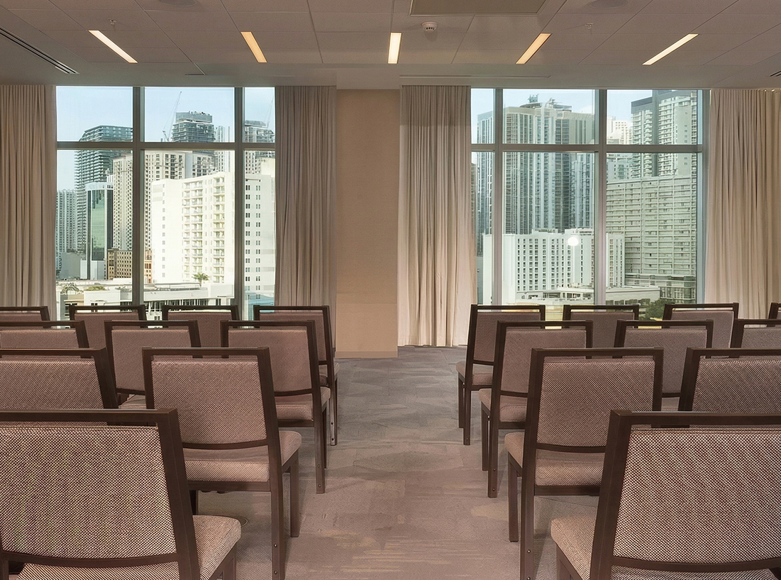 a room with chairs and windows