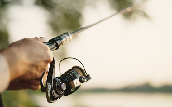 a person holding a fishing pole