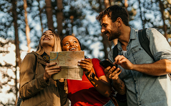 a group of people looking at a map