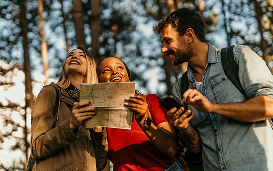 a group of people looking at a map