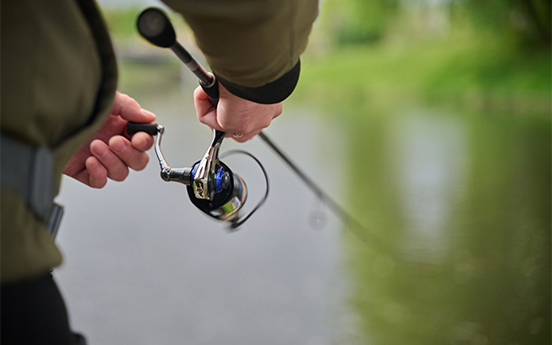 a person holding a fishing rod