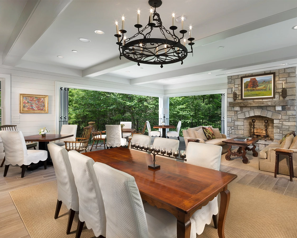 a room with a large table and chairs