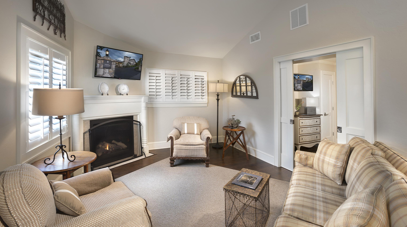 a living room with a fireplace and a couch