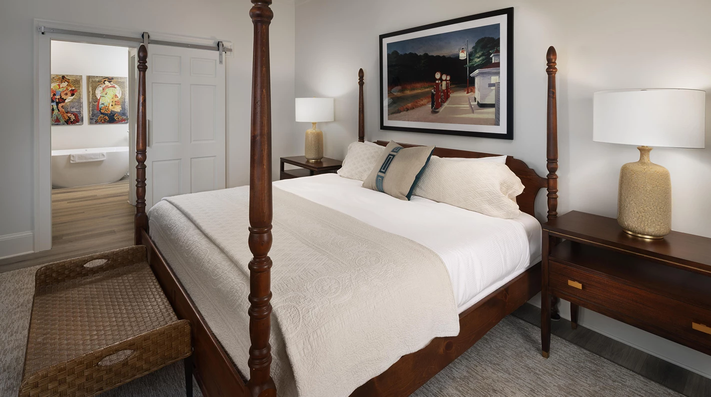 a bed with a four poster bed
