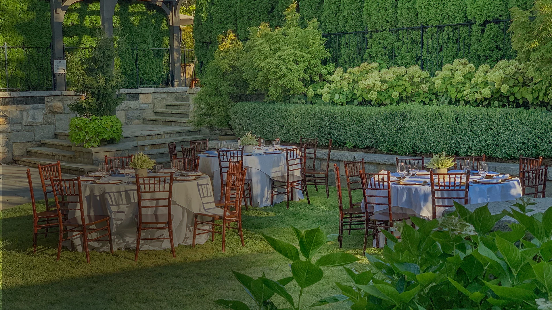 a group of tables and chairs outside