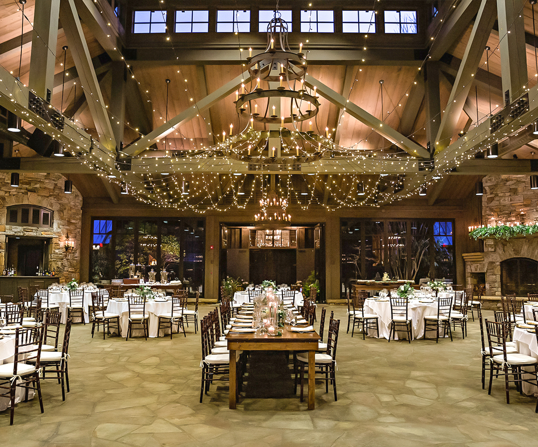 a room with tables and chairs and lights