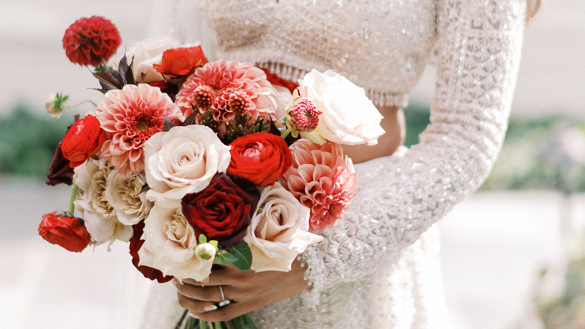 a woman holding a bouquet of flowers