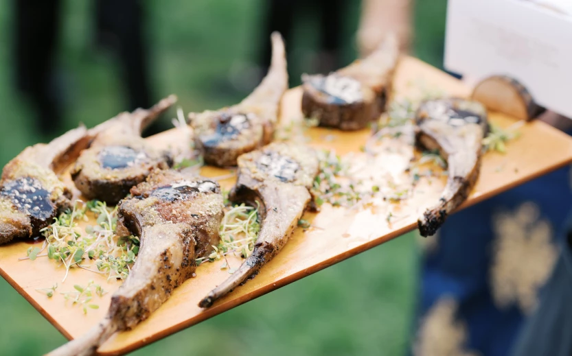 a plate of meat on a wooden board