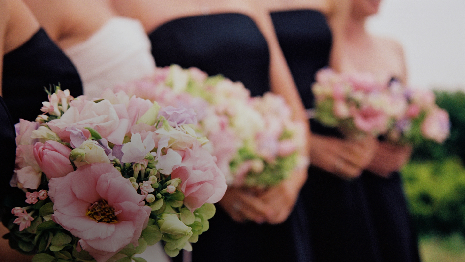 a group of women holding flowers