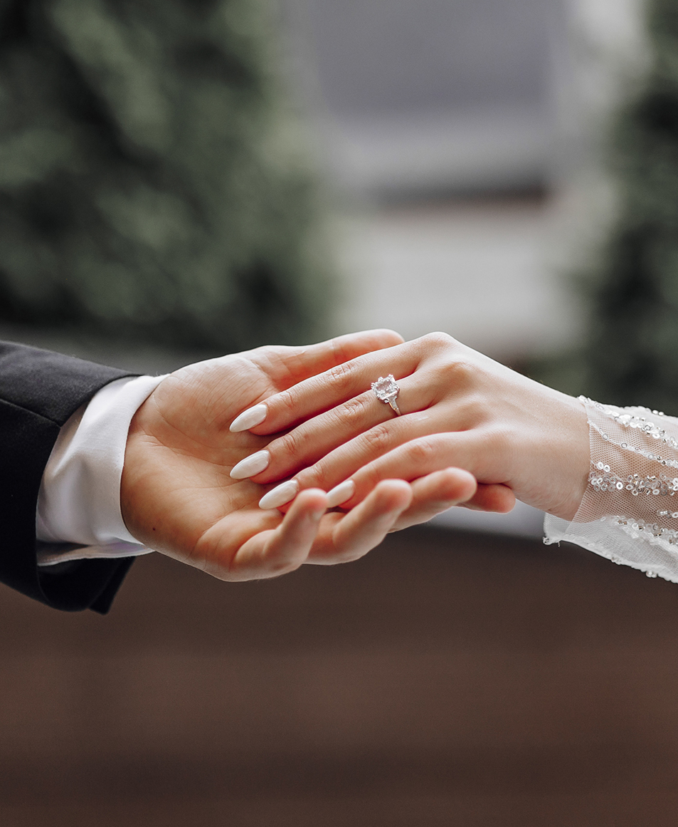 a man and woman holding hands