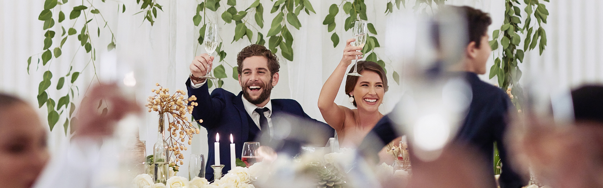 a man and woman holding wine glasses