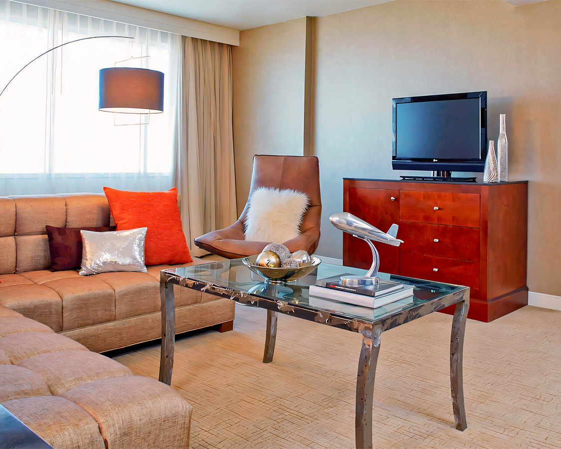 a living room with a tv and couches