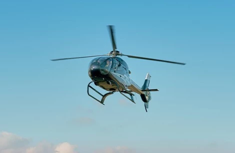 a helicopter flying in the sky