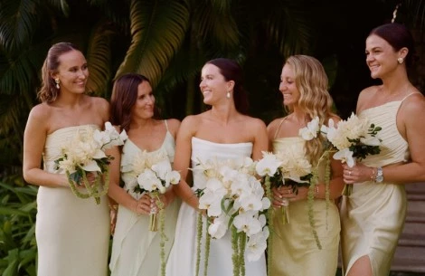 a group of women holding flowers