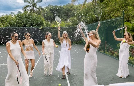 a group of women on a tennis court