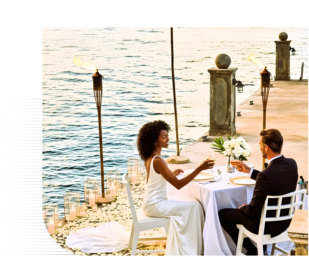 a man and woman sitting at a table with drinks