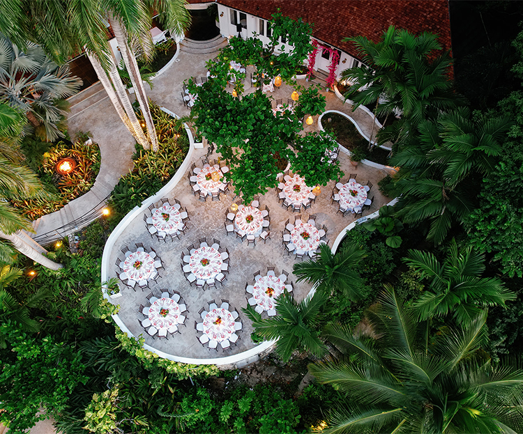 an aerial view of a courtyard with tables and chairs