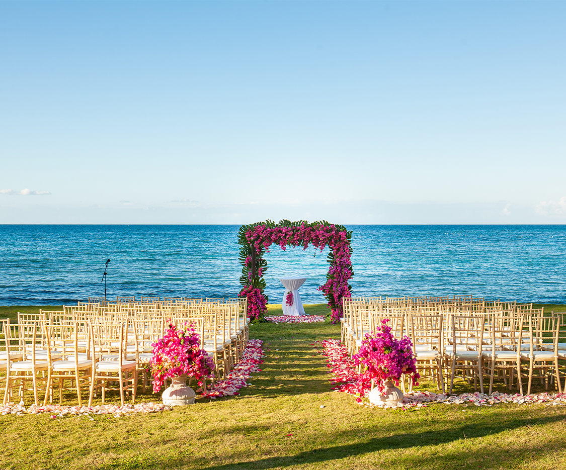 a wedding ceremony set up with chairs and flowers