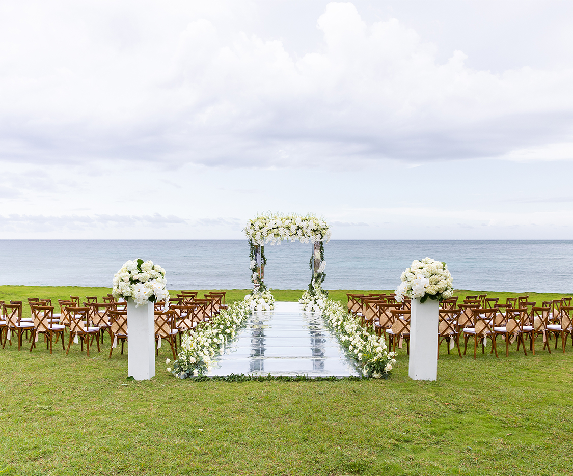 a wedding ceremony set up with chairs and a mirror walkway