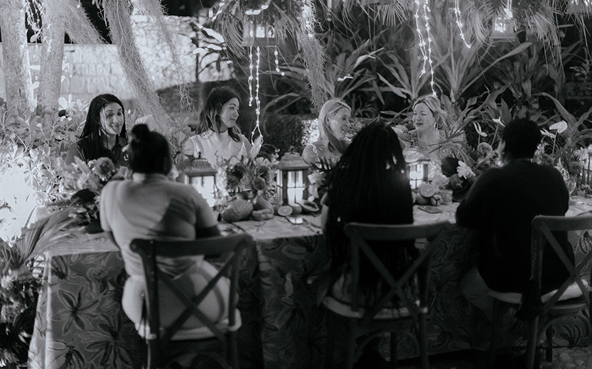 a group of women sitting around a table