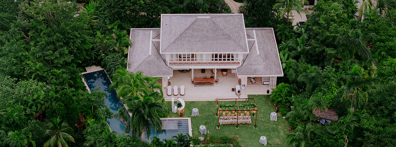 a house with a pool and tables