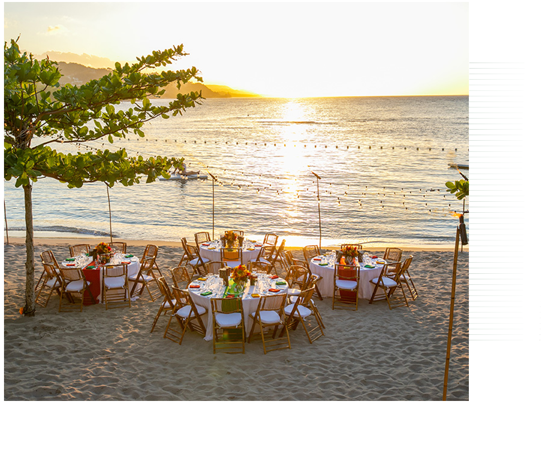 a group of tables set up on a beach