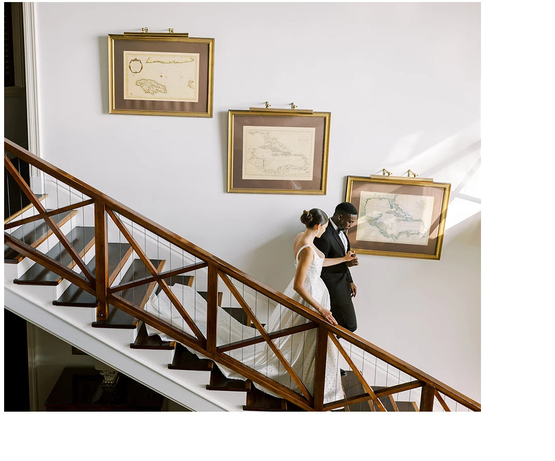 a man and woman walking up a staircase