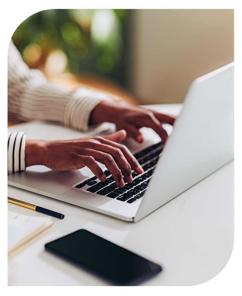 a person typing on a laptop