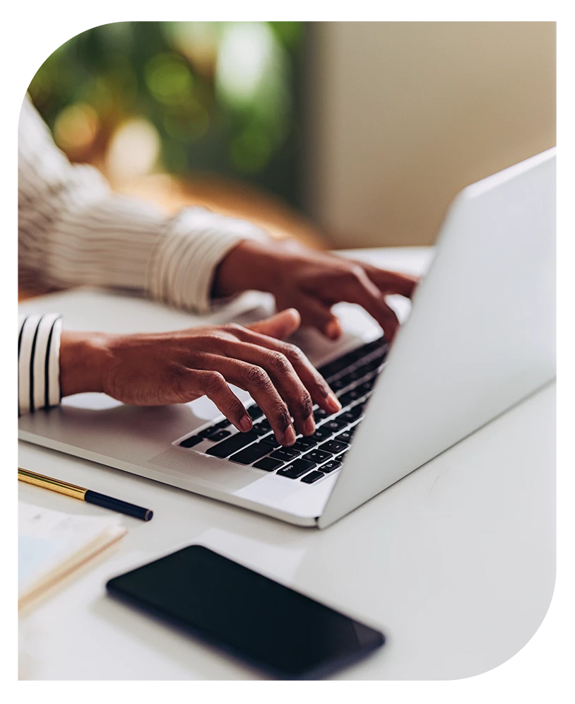 a person typing on a laptop