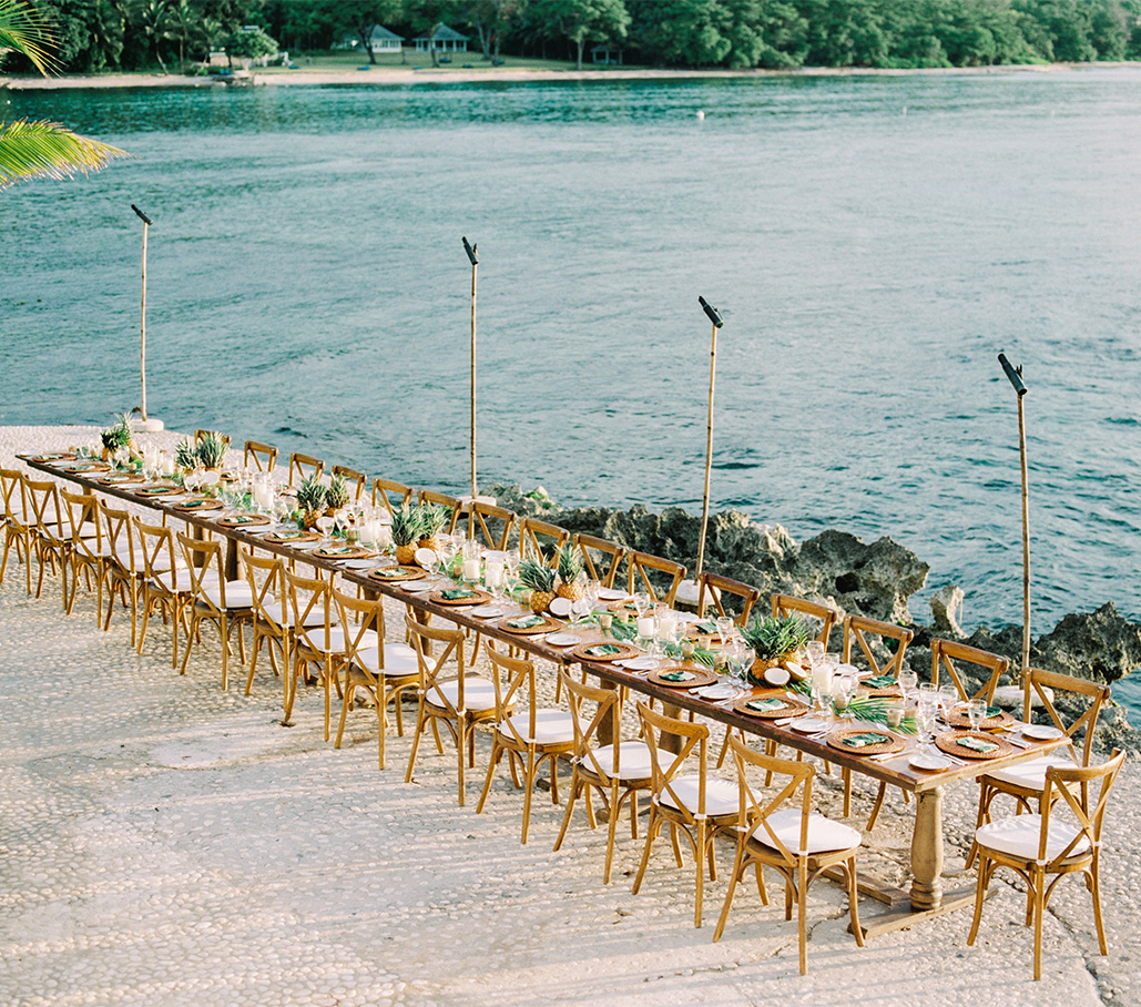 a long table set up on a beach