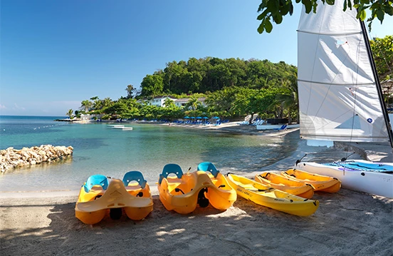 a group of kayaks on a beach