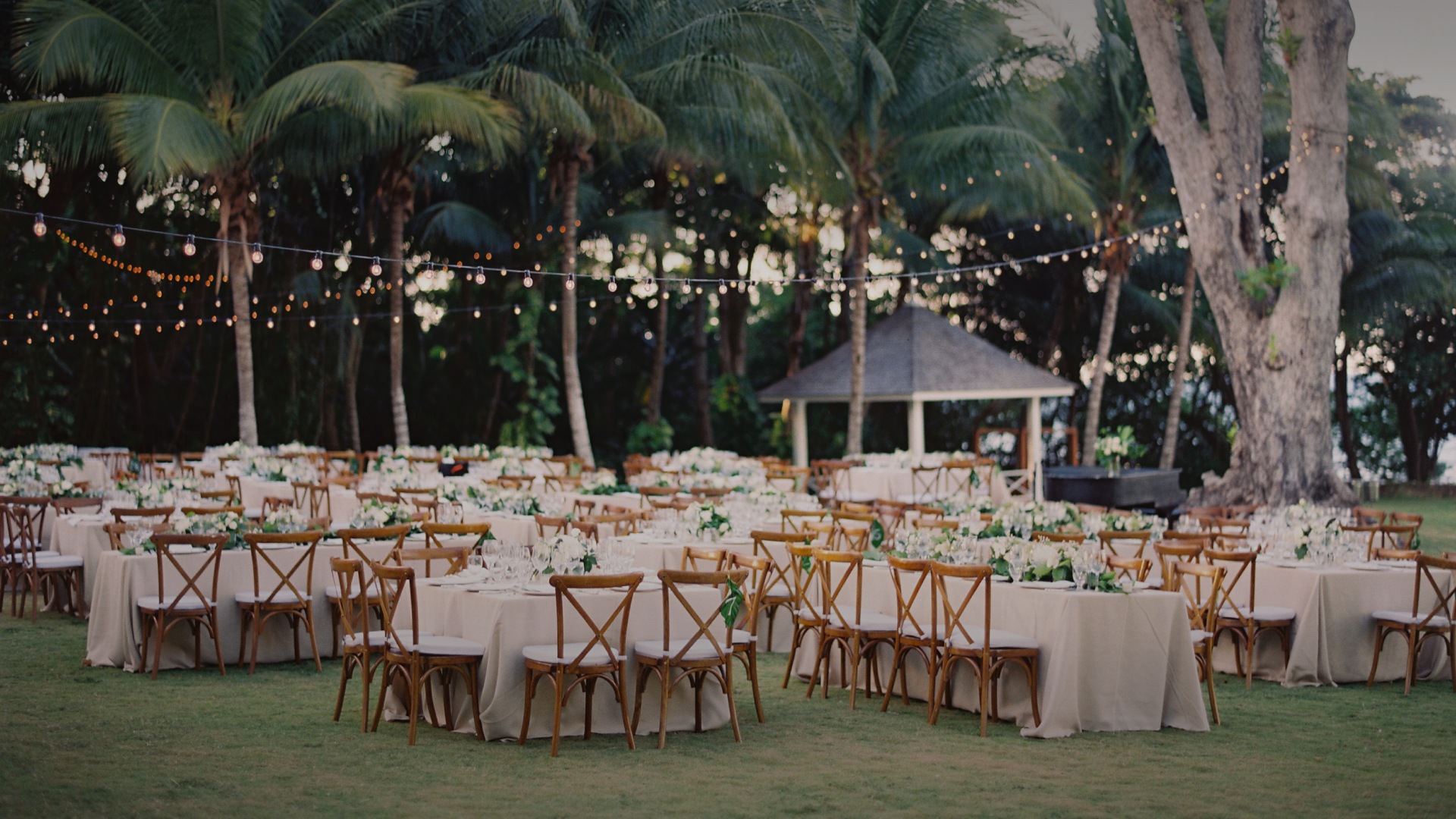 a group of tables and chairs in a garden