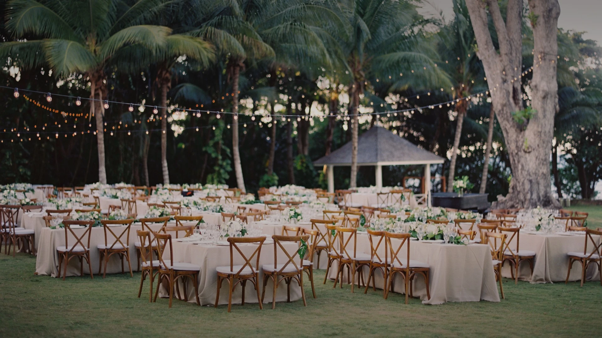 a group of tables and chairs in a garden