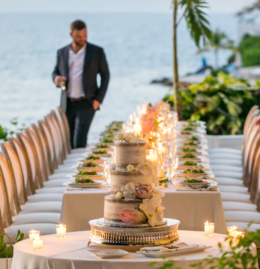 a table set with a cake and candles on it