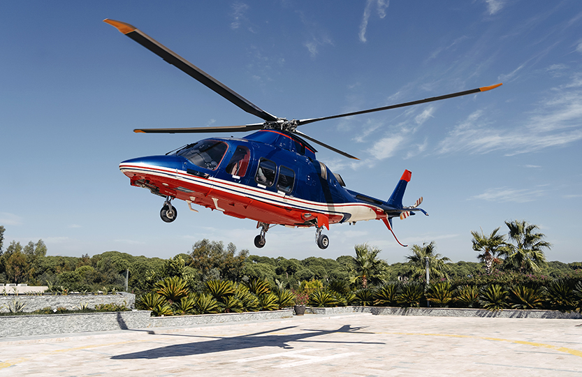 a helicopter flying over a rooftop