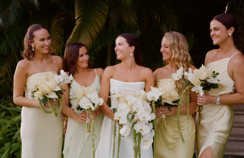 a group of women holding flowers