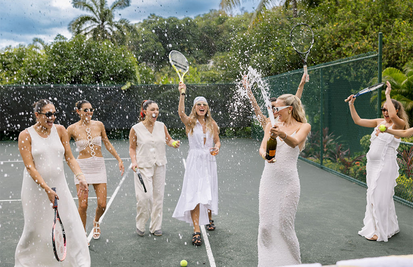 a group of women on a tennis court