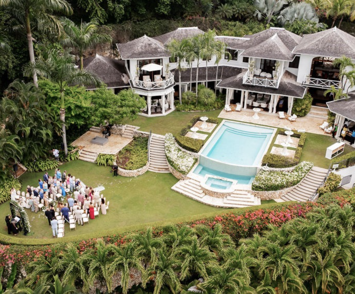 a group of people outside a house