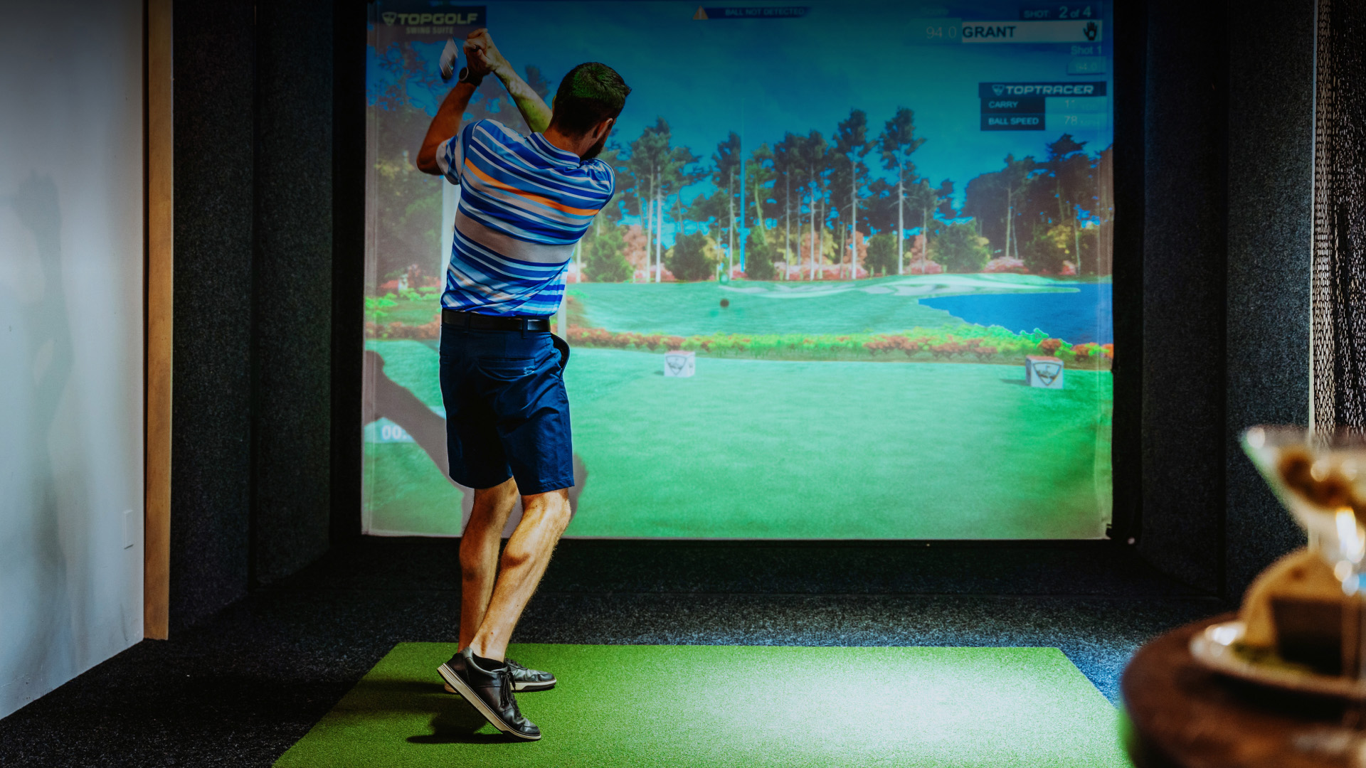 a man swinging a golf club