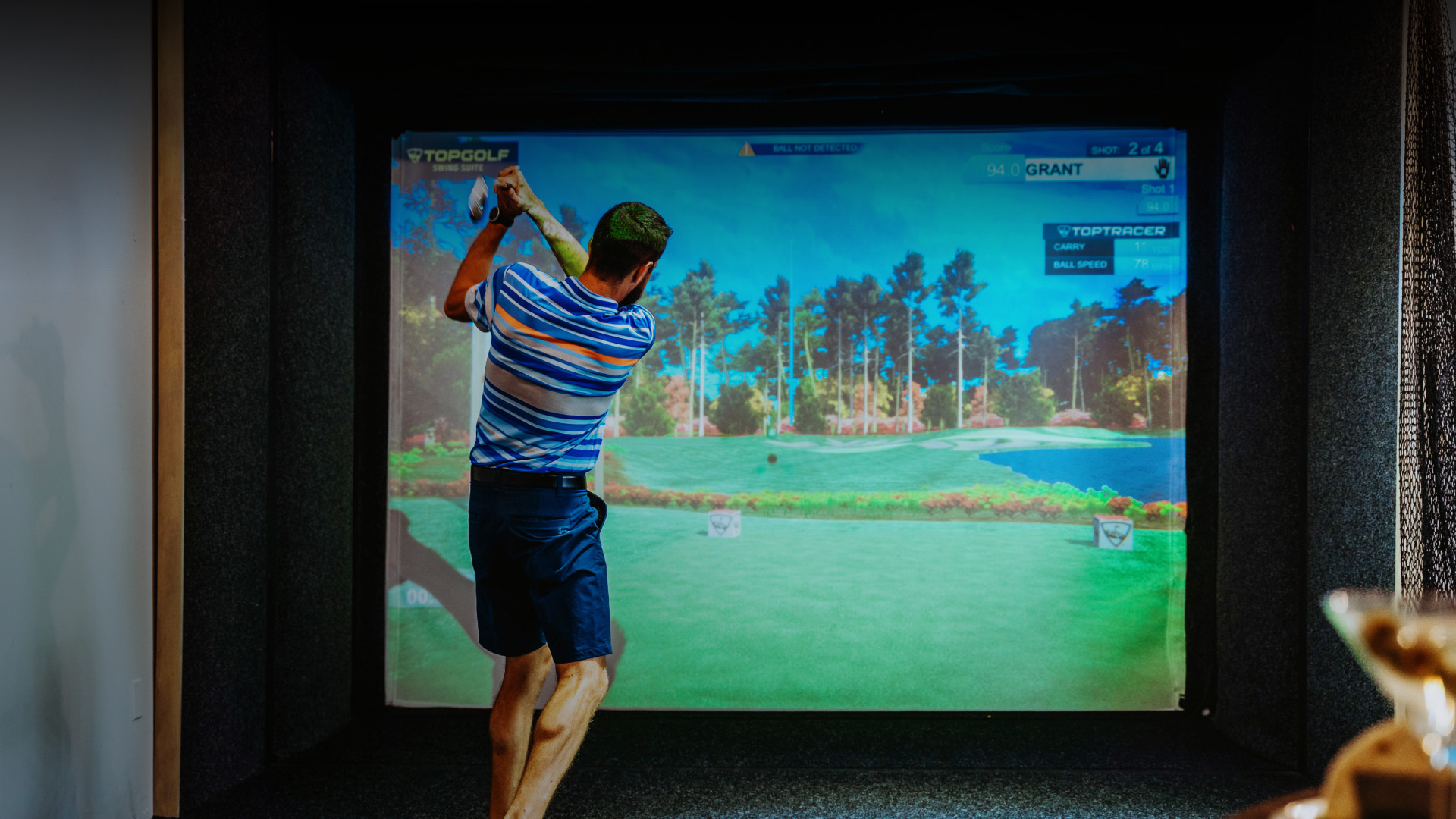 a man swinging a golf club