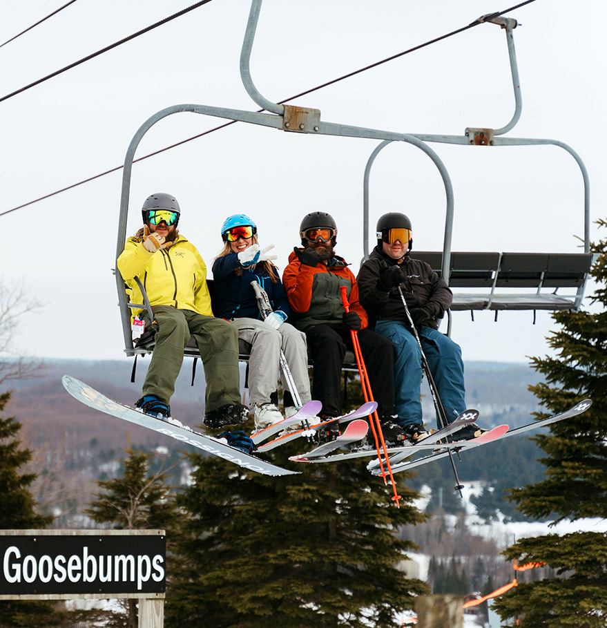 a group of people on skis in the air
