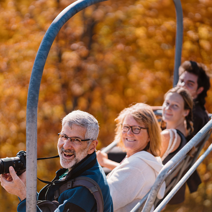 a group of people on a ski lift