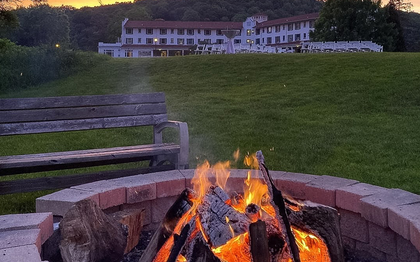 a campfire in front of a building