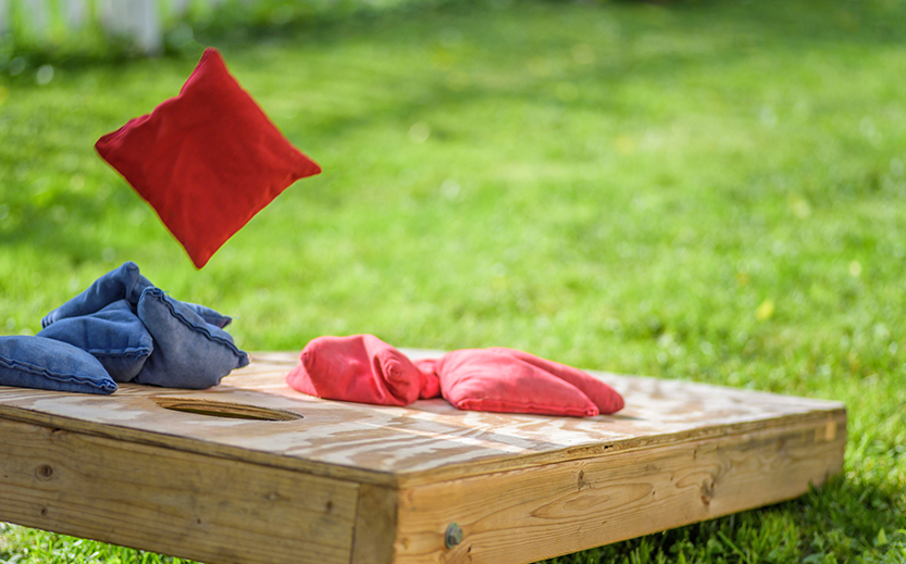 a red and blue pillows on a wooden board