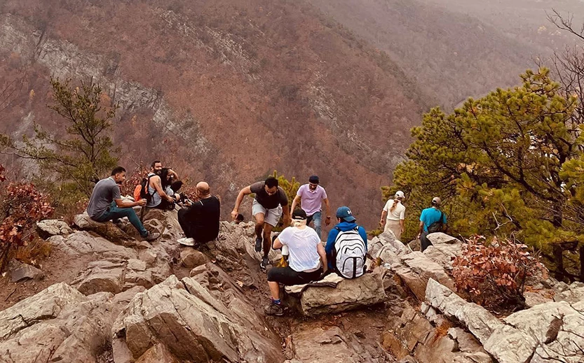 a group of people on a rocky mountain